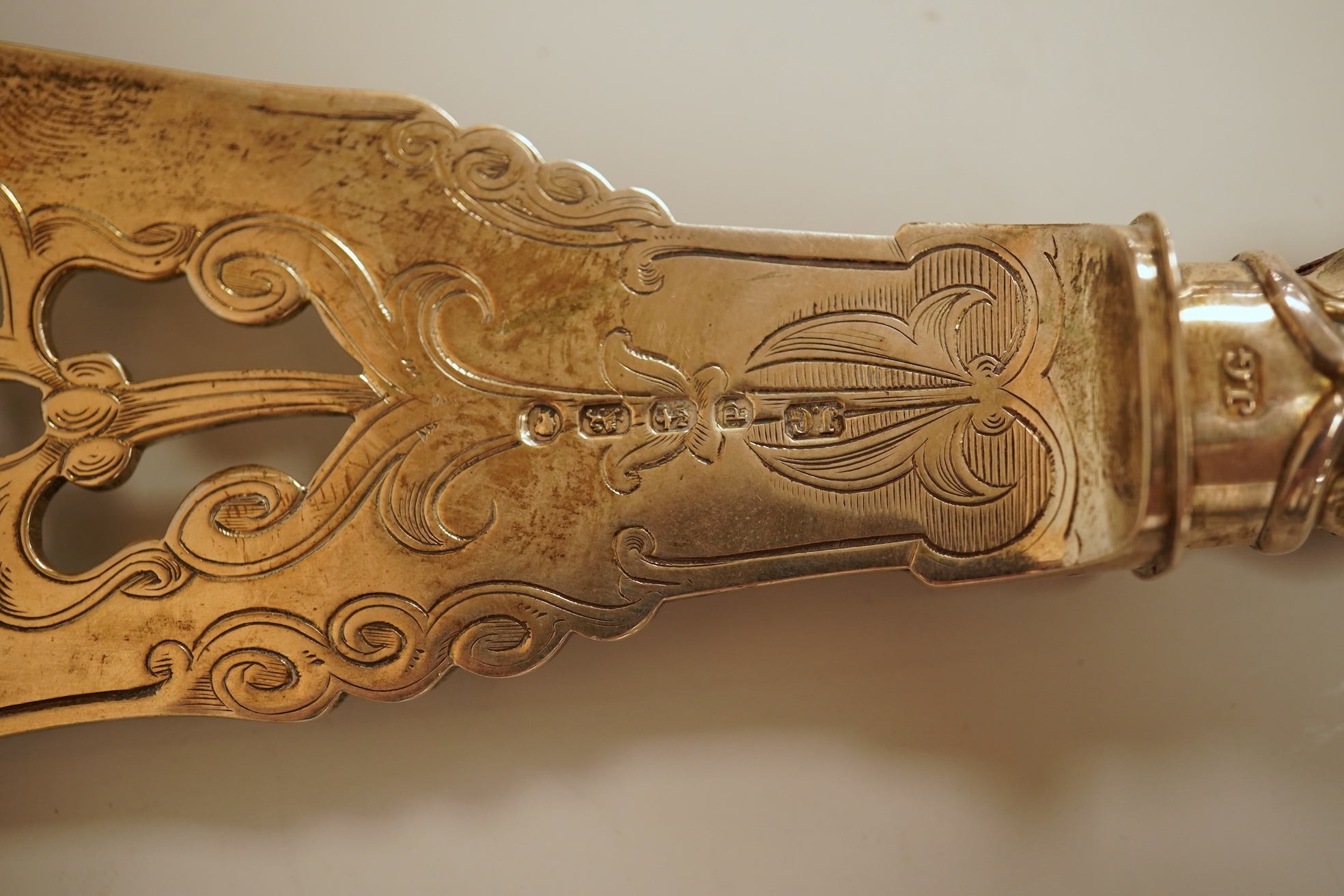 A pair of Victorian ornate silver fish servers, by John Gilbert, Birmingham, 1864, 34.1cm.